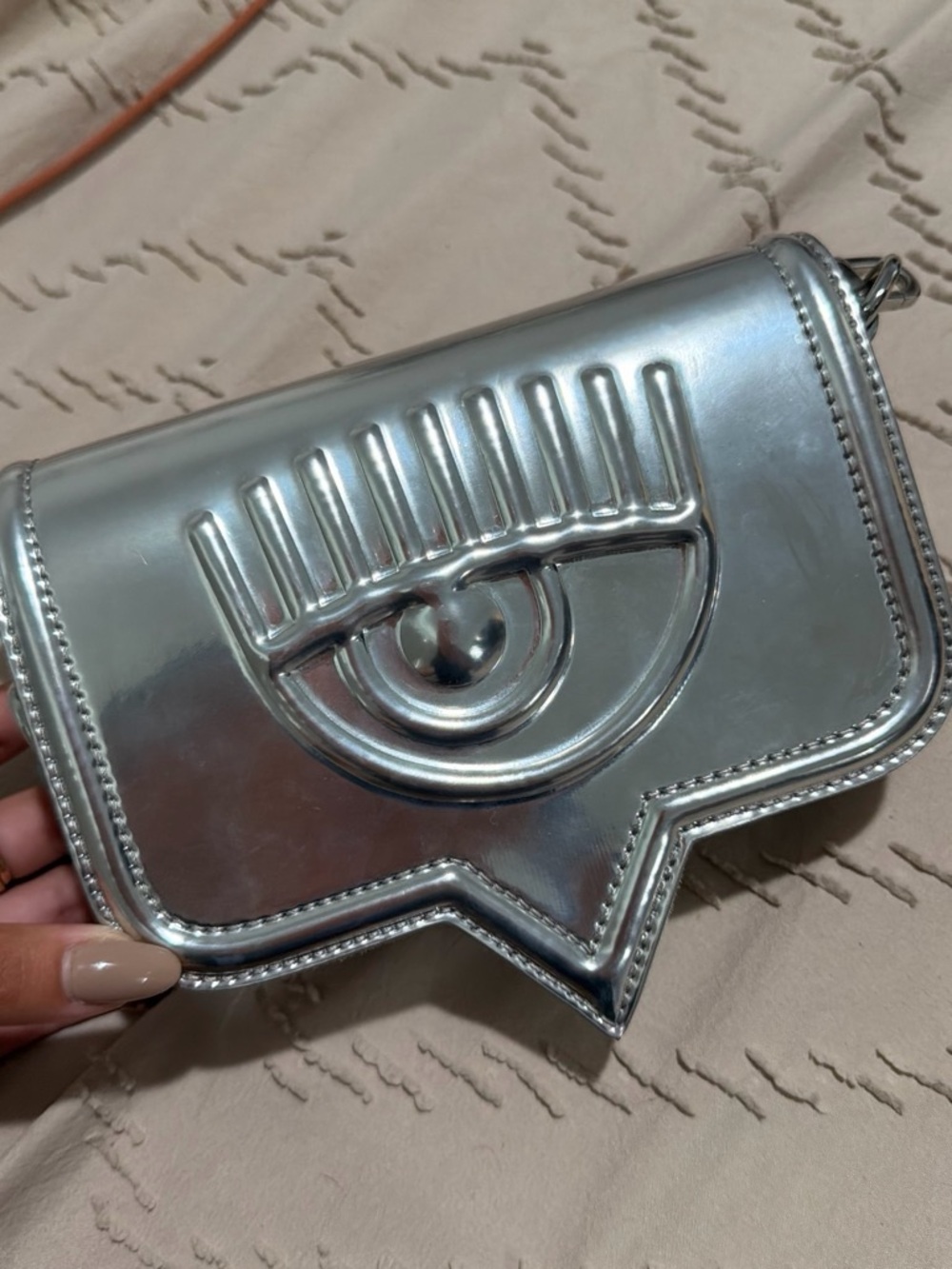 Chiara Ferragni Metallic Silver Eye-Accent Wristlet